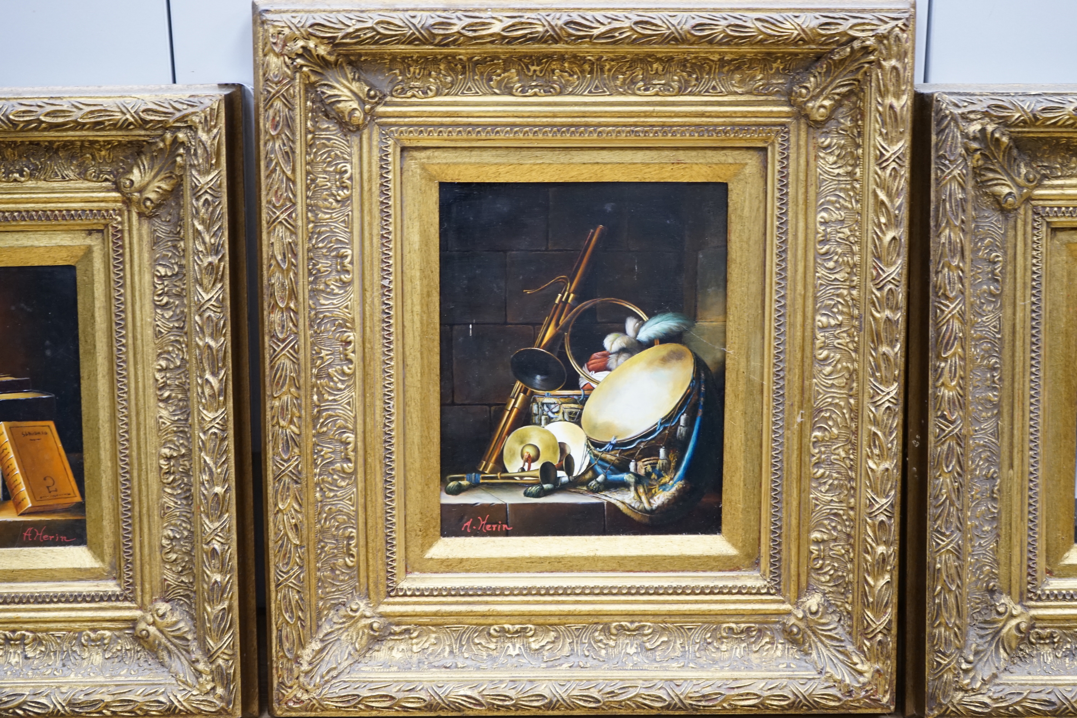 A Herin, set of three contemporary oils on board, Still lifes of musical instruments and sheet music, two signed, each 19 x 24cm, ornate gilt framed